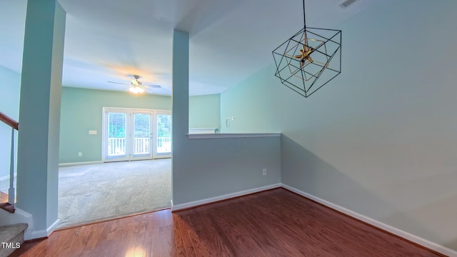151 Braeside Ct, Cary, NC 27519 - unfurnished dining area with baseboards, a ceiling fan, wood finished floors, a chandelier, and carpet flooring