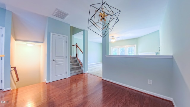 151 Braeside Ct, Cary, NC 27519 - unfurnished dining area featuring wood finished floors, baseboards, and a chandelier