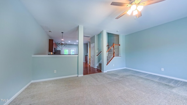 151 Braeside Ct, Cary, NC 27519 - unfurnished living room with carpet floors, baseboards, stairway, and a ceiling fan