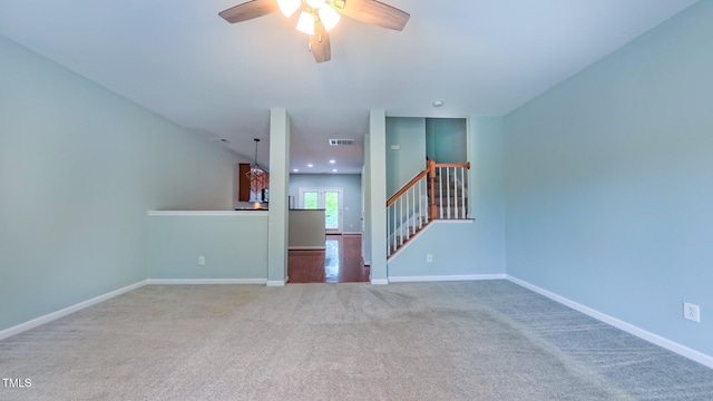 151 Braeside Ct, Cary, NC 27519 - unfurnished living room featuring a ceiling fan, carpet flooring, baseboards, and stairs