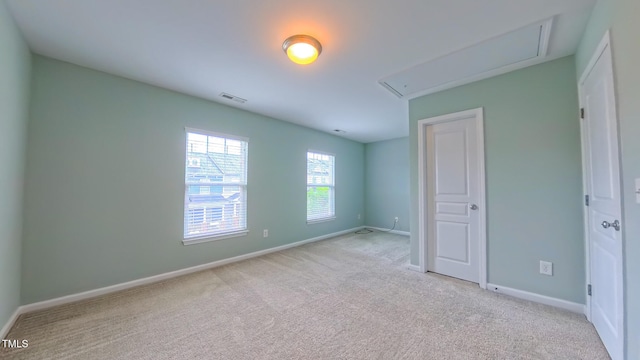 151 Braeside Ct, Cary, NC 27519 - unfurnished bedroom with attic access, carpet, and baseboards
