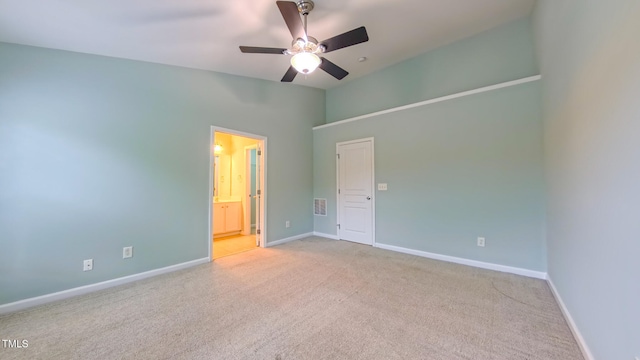 151 Braeside Ct, Cary, NC 27519 - unfurnished bedroom featuring carpet, baseboards, ensuite bath, lofted ceiling, and a ceiling fan