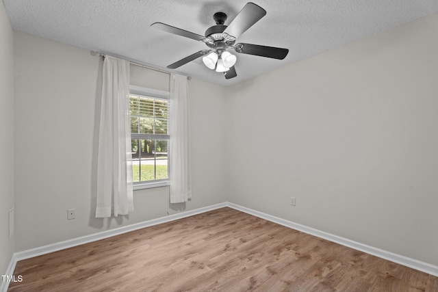 428 Long Branch Dr, Lacrosse, VA 23950 - empty room with light wood finished floors, baseboards, a textured ceiling, and ceiling fan