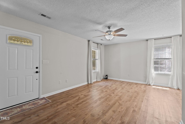 428 Long Branch Dr, Lacrosse, VA 23950 - spare room with a ceiling fan, light wood finished floors, a textured ceiling, and baseboards