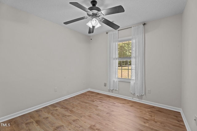 428 Long Branch Dr, Lacrosse, VA 23950 - spare room with light wood finished floors, a textured ceiling, baseboards, and a ceiling fan