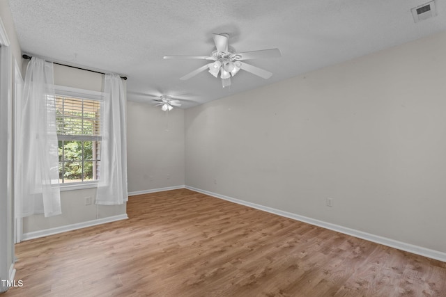 428 Long Branch Dr, Lacrosse, VA 23950 - unfurnished room featuring light wood-style flooring, baseboards, ceiling fan, and a textured ceiling