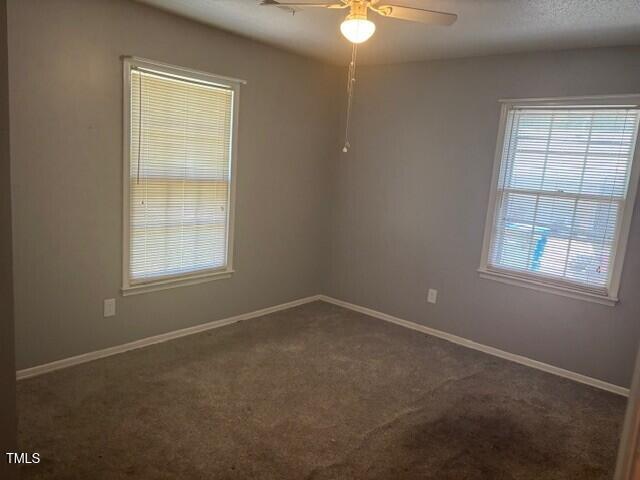 708 Old Barn Ave, Durham, NC 27704 - carpeted spare room featuring ceiling fan and baseboards