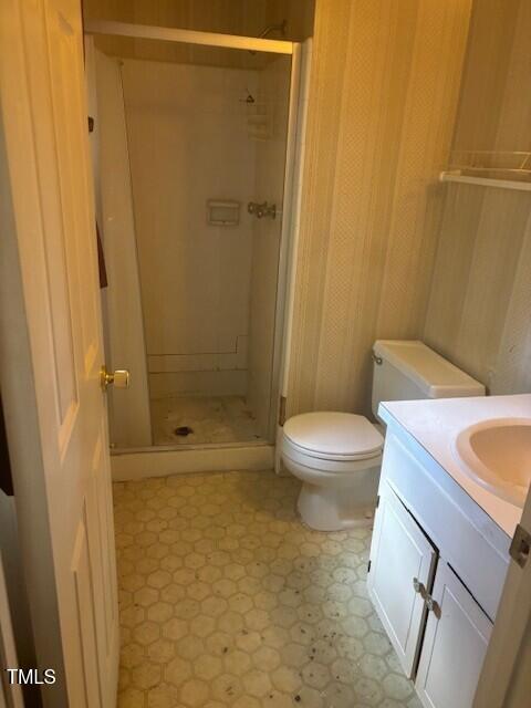 708 Old Barn Ave, Durham, NC 27704 - full bathroom with a stall shower, toilet, and vanity