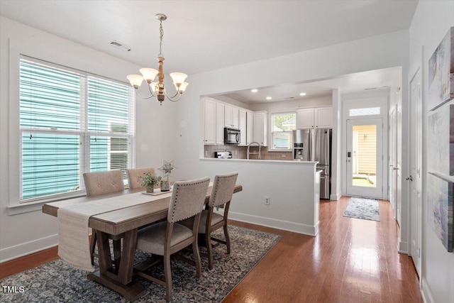 4605 All Points View Way, Raleigh, NC 27614 - dining area with a chandelier, wood finished floors, baseboards, and recessed lighting