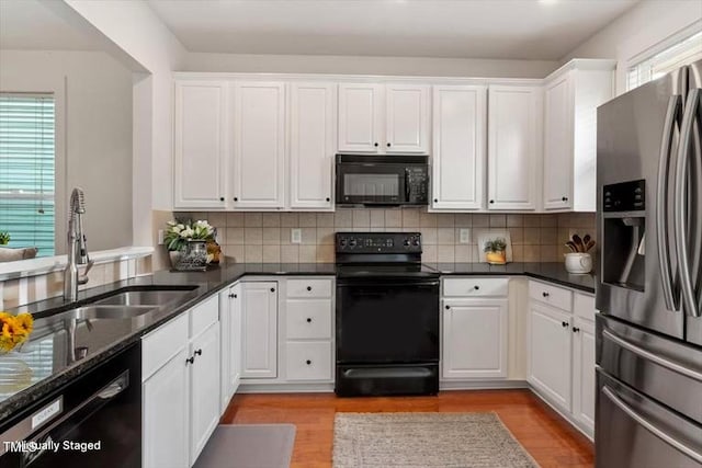 4605 All Points View Way, Raleigh, NC 27614 - kitchen featuring black appliances, healthy amount of natural light, a sink, and light wood finished floors