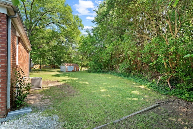 1411 Hudson Ave, Durham, NC 27705 - view of green lawn with central air condition unit