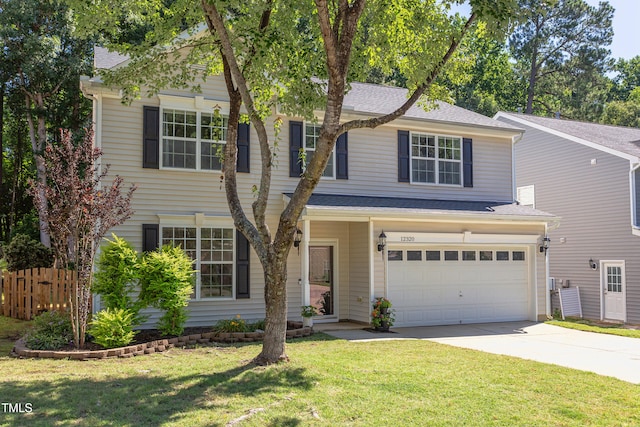 12320 Tetons Ct, Durham, NC 27703 - view of front of home with concrete driveway, an attached garage, and a shingled roof