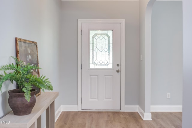 12320 Tetons Ct, Durham, NC 27703 - entryway with arched walkways and light wood-style floors