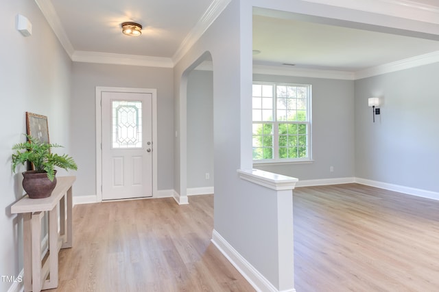 12320 Tetons Ct, Durham, NC 27703 - foyer with arched walkways, light wood-style floors, and crown molding