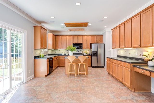 12320 Tetons Ct, Durham, NC 27703 - kitchen featuring stainless steel appliances, dark countertops, backsplash, a kitchen island, and recessed lighting
