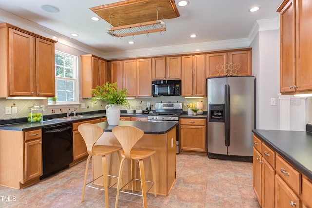 12320 Tetons Ct, Durham, NC 27703 - kitchen with black appliances, dark countertops, a kitchen bar, ornamental molding, and a center island