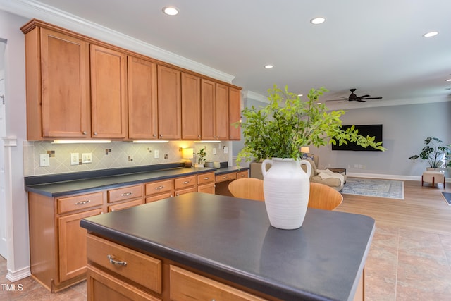 12320 Tetons Ct, Durham, NC 27703 - kitchen with crown molding, dark countertops, ceiling fan, recessed lighting, and tasteful backsplash