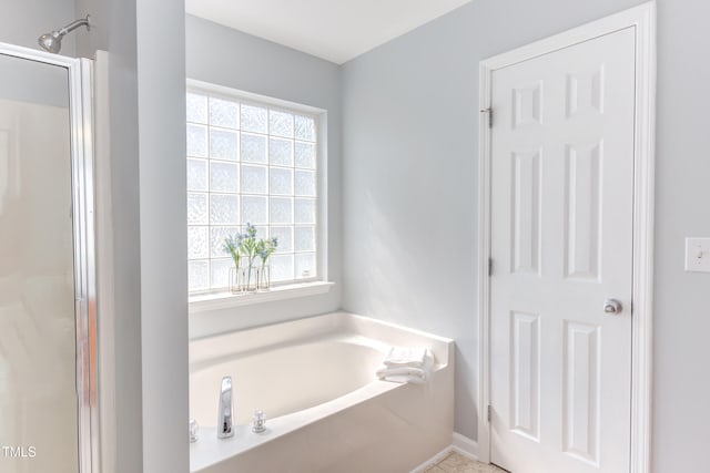 12320 Tetons Ct, Durham, NC 27703 - full bathroom featuring a garden tub and a shower with door