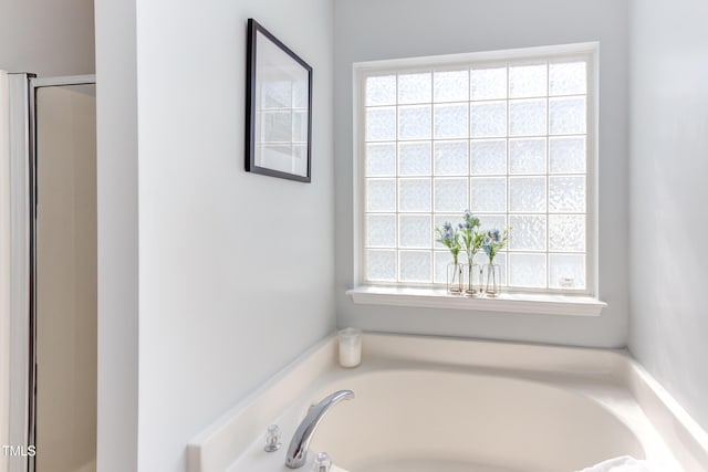 12320 Tetons Ct, Durham, NC 27703 - bathroom with a bath and a shower