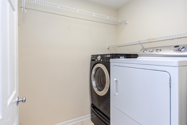 12320 Tetons Ct, Durham, NC 27703 - laundry room featuring separate washer and dryer and light tile patterned floors