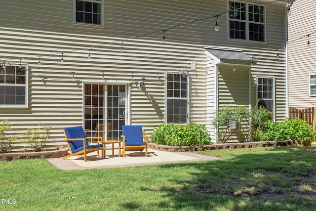 12320 Tetons Ct, Durham, NC 27703 - rear view of property with a yard and a patio