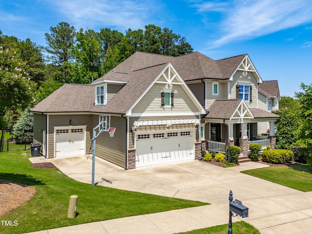 2538 Tuffeto, Apex, NC 27502 - craftsman inspired home with a porch, driveway, stone siding, roof with shingles, and an attached garage