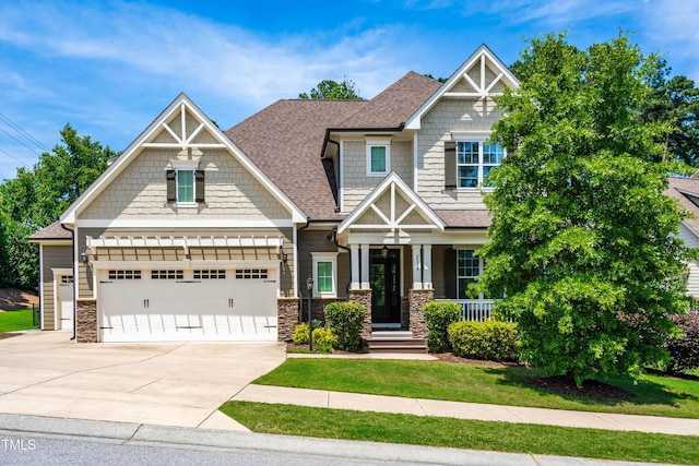 2538 Tuffeto, Apex, NC 27502 - craftsman house with driveway, stone siding, roof with shingles, and a porch