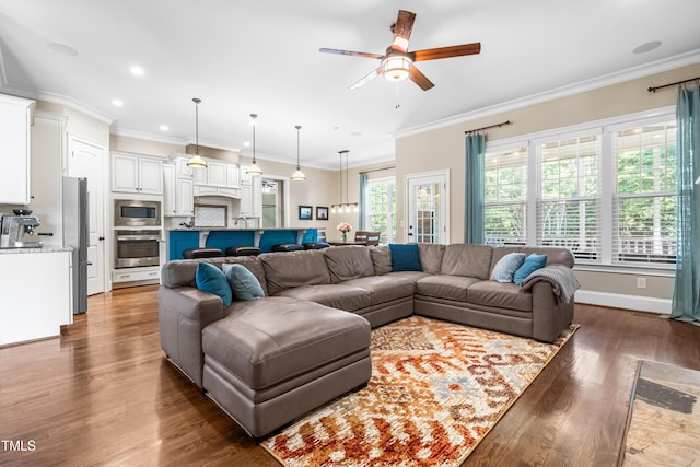 2538 Tuffeto, Apex, NC 27502 - living area featuring a ceiling fan, ornamental molding, dark wood-type flooring, and recessed lighting