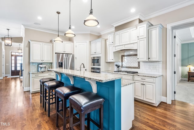 2538 Tuffeto, Apex, NC 27502 - kitchen featuring stainless steel appliances, an island with sink, dark wood-style flooring, a kitchen breakfast bar, and decorative backsplash