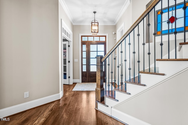 2538 Tuffeto, Apex, NC 27502 - entrance foyer featuring wood finished floors, stairs, ornamental molding, and baseboards