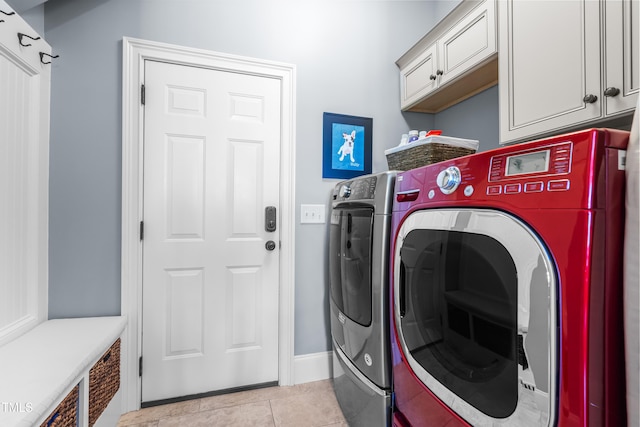 2538 Tuffeto, Apex, NC 27502 - laundry room with separate washer and dryer, cabinet space, light tile patterned flooring, and baseboards