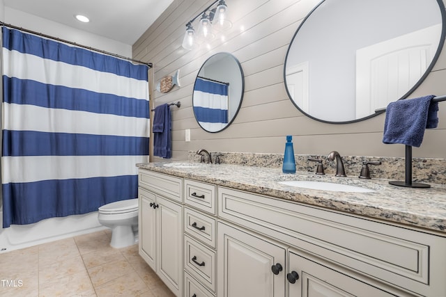 2538 Tuffeto, Apex, NC 27502 - bathroom with double vanity, toilet, tile patterned floors, wooden walls, and shower / bathtub combination with curtain