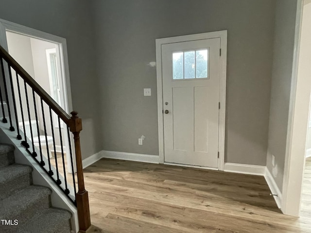 268 Busterfield Ct, Benson, NC 27504 - foyer entrance with wood finished floors, baseboards, and stairs