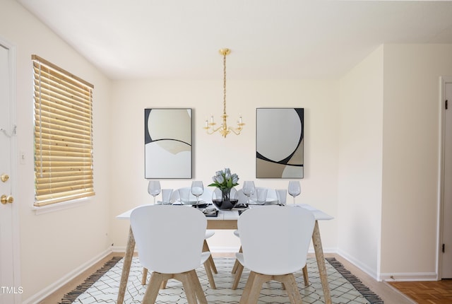 1002 Willow Dr Unit 37, Chapel Hill, NC 27514 - dining room with a chandelier and baseboards