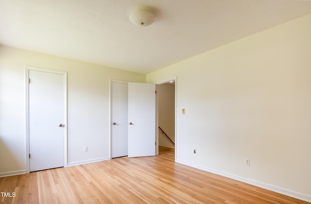 1002 Willow Dr Unit 37, Chapel Hill, NC 27514 - unfurnished bedroom with light wood-style flooring and baseboards