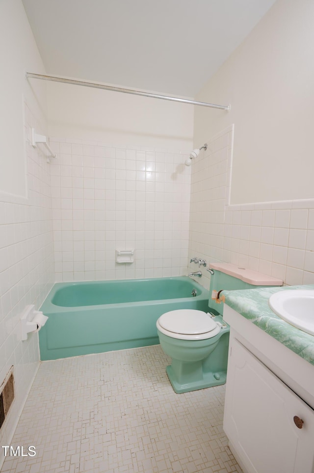 1002 Willow Dr Unit 37, Chapel Hill, NC 27514 - full bath featuring tile walls, bathtub / shower combination, vanity, toilet, and tile patterned floors