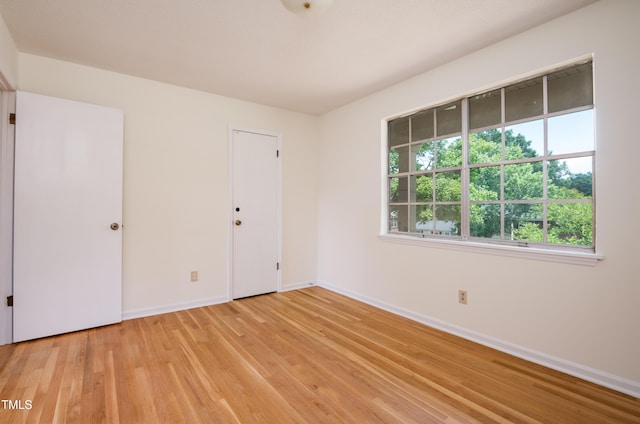1002 Willow Dr Unit 37, Chapel Hill, NC 27514 - unfurnished room with baseboards and light wood-style floors