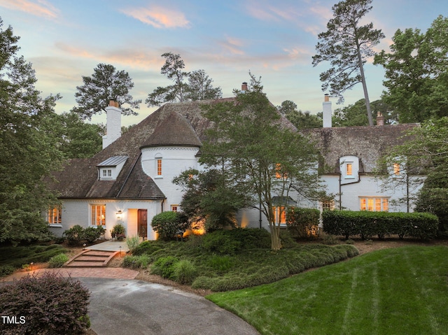 3307 Devon Rd, Durham, NC 27707 - tudor house with a chimney and a front yard