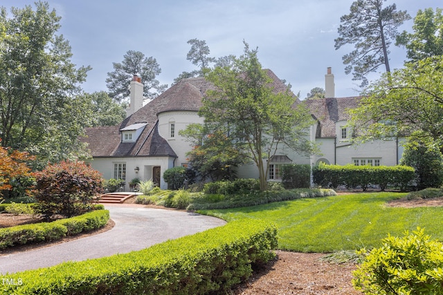 3307 Devon Rd, Durham, NC 27707 - view of front facade featuring a chimney and a front yard