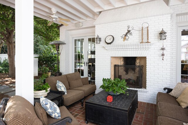 3307 Devon Rd, Durham, NC 27707 - living room featuring brick flooring, brick wall, a ceiling fan, and a fireplace