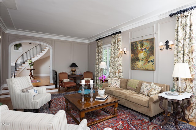 3307 Devon Rd, Durham, NC 27707 - living area featuring crown molding, a decorative wall, stairway, and arched walkways