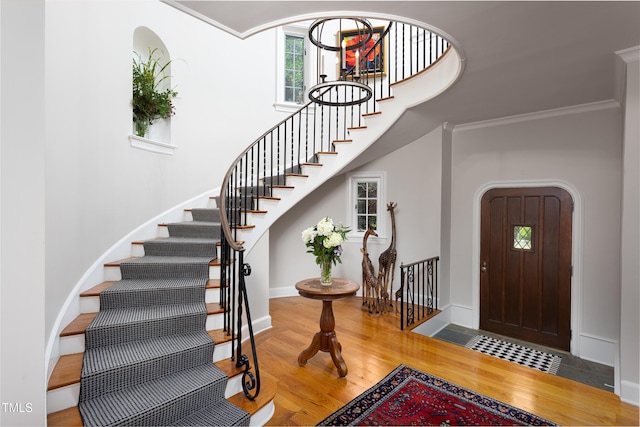 3307 Devon Rd, Durham, NC 27707 - entryway featuring wood finished floors, stairway, crown molding, and baseboards