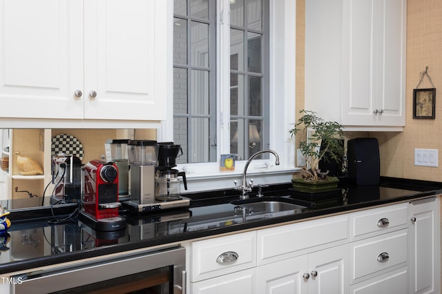 3307 Devon Rd, Durham, NC 27707 - kitchen with wine cooler, backsplash, white cabinets, and dark countertops