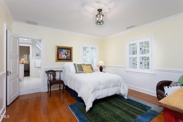 3307 Devon Rd, Durham, NC 27707 - bedroom with ornamental molding, wood finished floors, and wainscoting