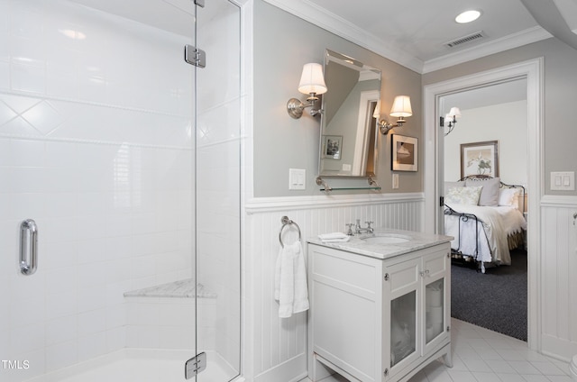 3307 Devon Rd, Durham, NC 27707 - bathroom with a stall shower, vanity, connected bathroom, a wainscoted wall, and ornamental molding