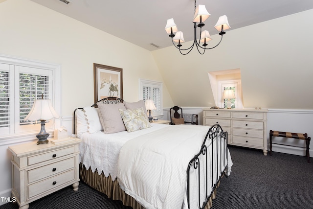 3307 Devon Rd, Durham, NC 27707 - bedroom with a chandelier, dark carpet, and vaulted ceiling