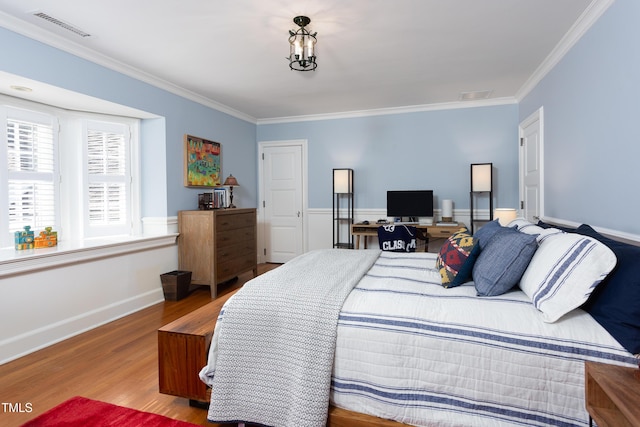 3307 Devon Rd, Durham, NC 27707 - bedroom featuring ornamental molding, wood finished floors, and baseboards