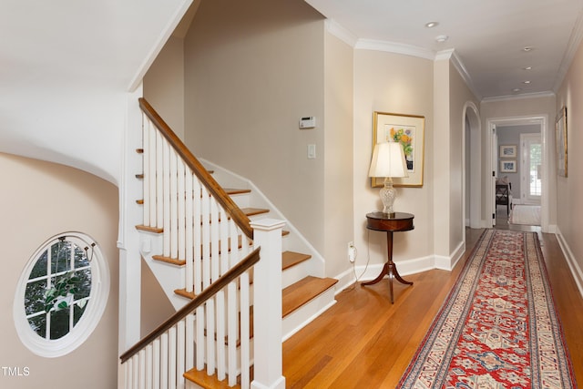 3307 Devon Rd, Durham, NC 27707 - stairs featuring wood finished floors, healthy amount of natural light, ornamental molding, baseboards, and recessed lighting