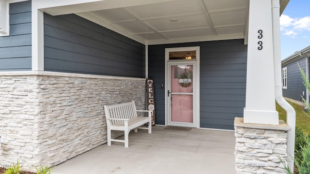 33 Davidson St, Clayton, NC 27527 - property entrance featuring covered porch and stone siding