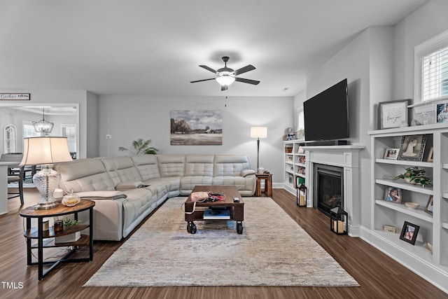 33 Davidson St, Clayton, NC 27527 - living area with a ceiling fan, a fireplace, dark wood finished floors, built in features, and baseboards